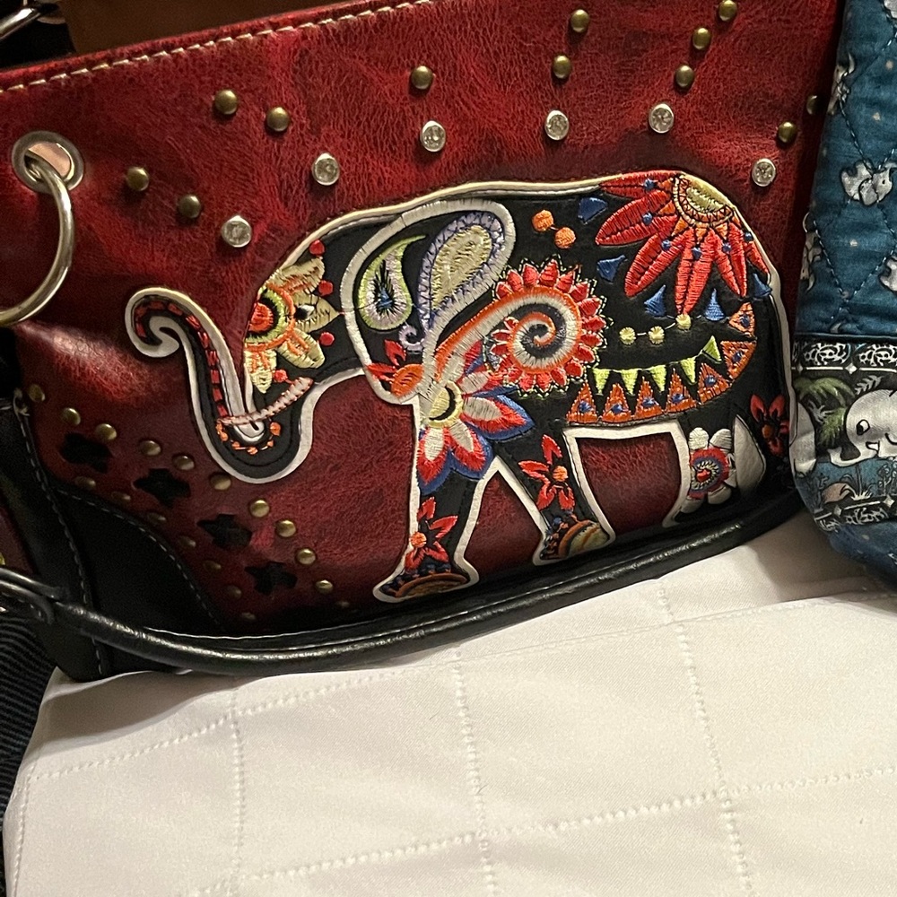 Two elephant purses. One brown one blue both in great shape